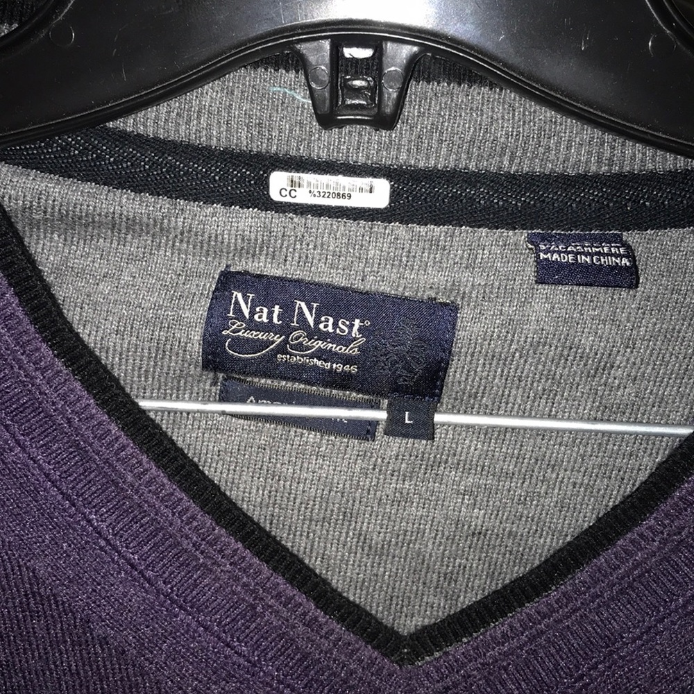 Purple long sleeve sweater. Light weather.